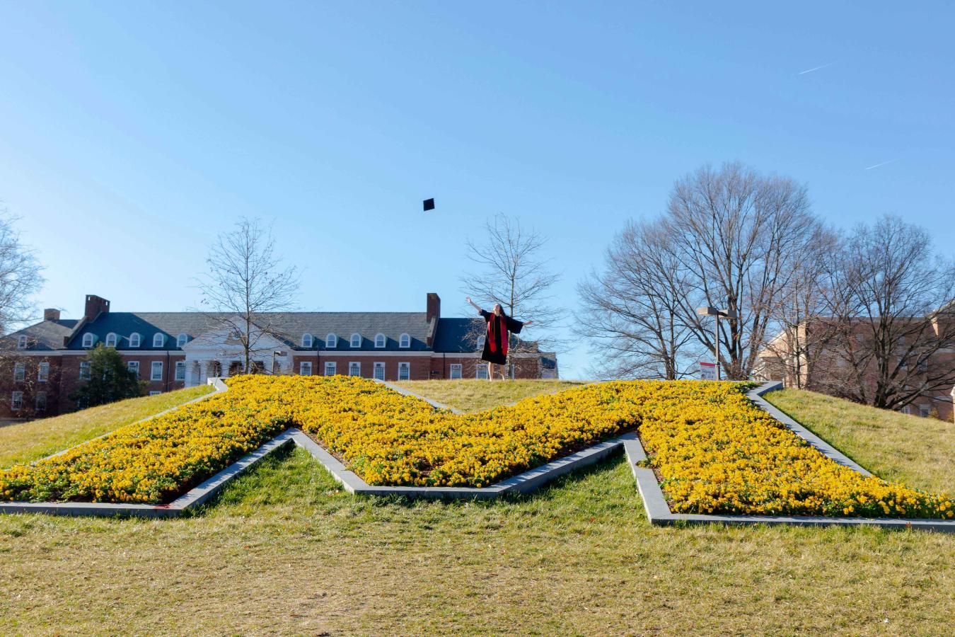 Student throwing their grad cap in the air