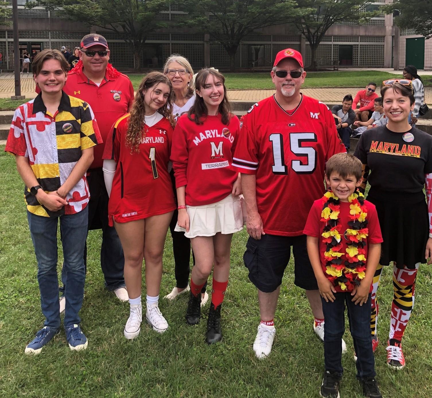 Family of Terps wearing Maryland gear at an event