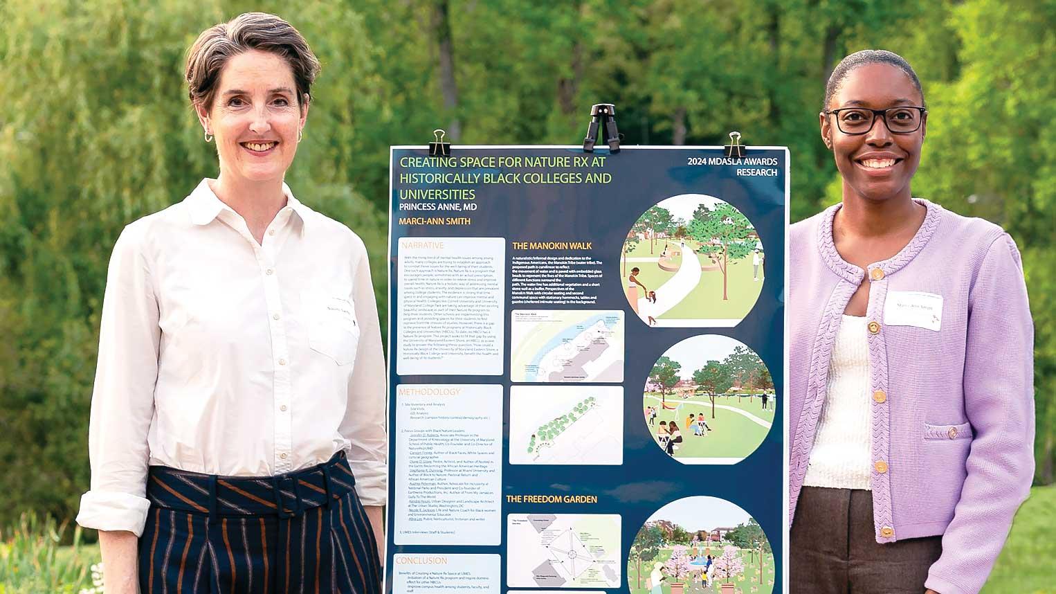 Marci-Ann Smith standing with Naomi Sachs text to her poster display